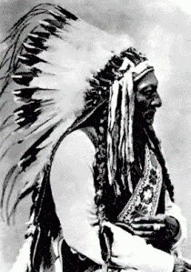 Tatanka Iyotake or Sitting Bull, is pictured in his eagle feather headdress. 