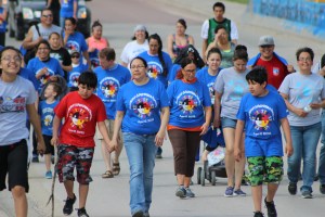 Shelley Means walks with her twin sons in Mission on April 30, 2014. Click on the link below to watch the students of Rosebud Elementary walk for Autism Awareness. 