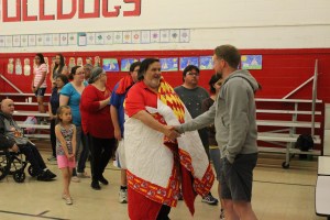 Dr. Bordeaux’s family accompanied him in the honor song rendered by the Red Leaf Singers. Community members, students and staff stepped forward to acknowledge his accomplishments as TCSD Superintendent. Photo by Vi Waln.
